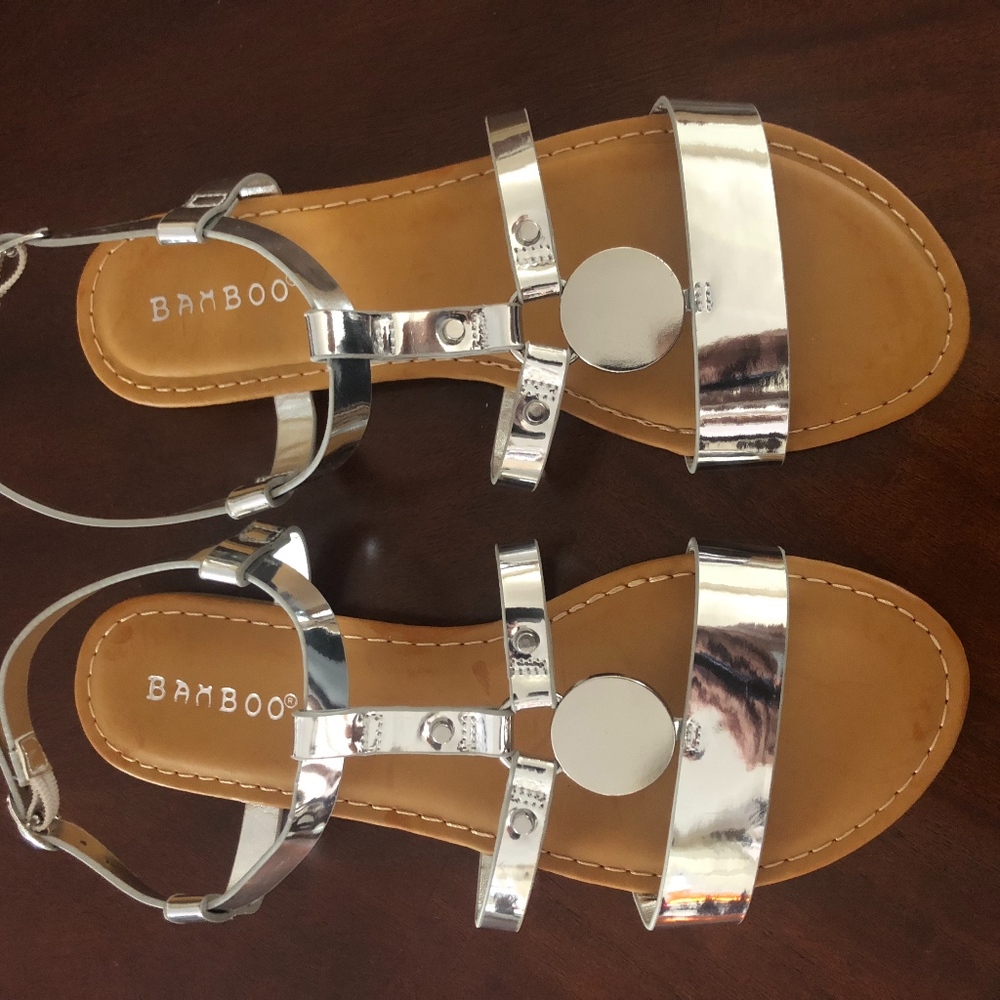 New, never worn silver flats